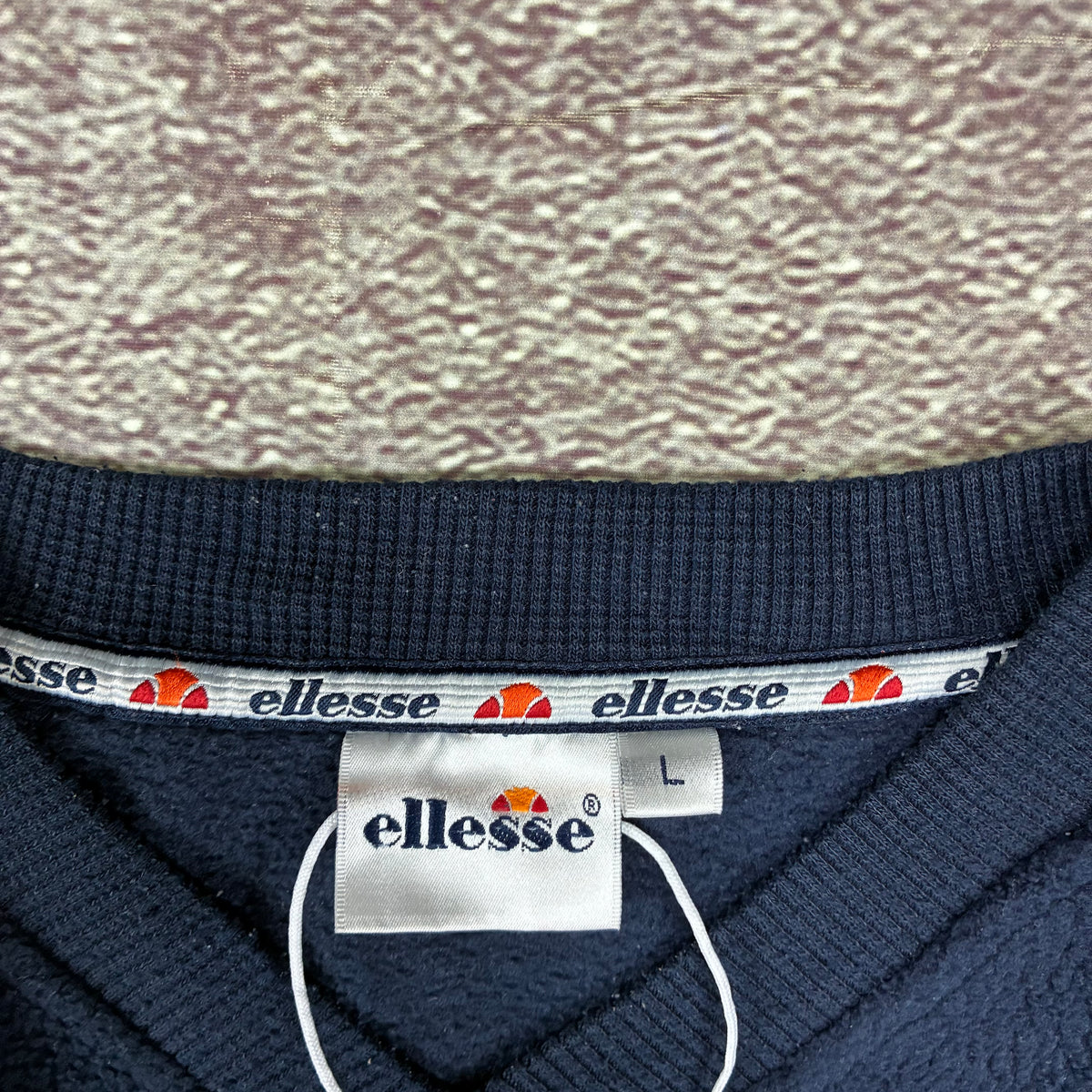 Vintage Ellesse semicircle logo detail