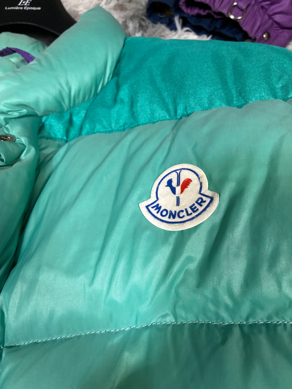 Moncler Grenoble teal puffer defect close-up — please review