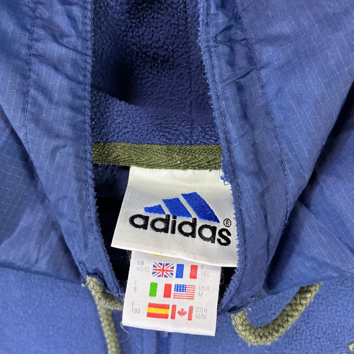 Vintage Adidas fleece hoodie size tag close-up