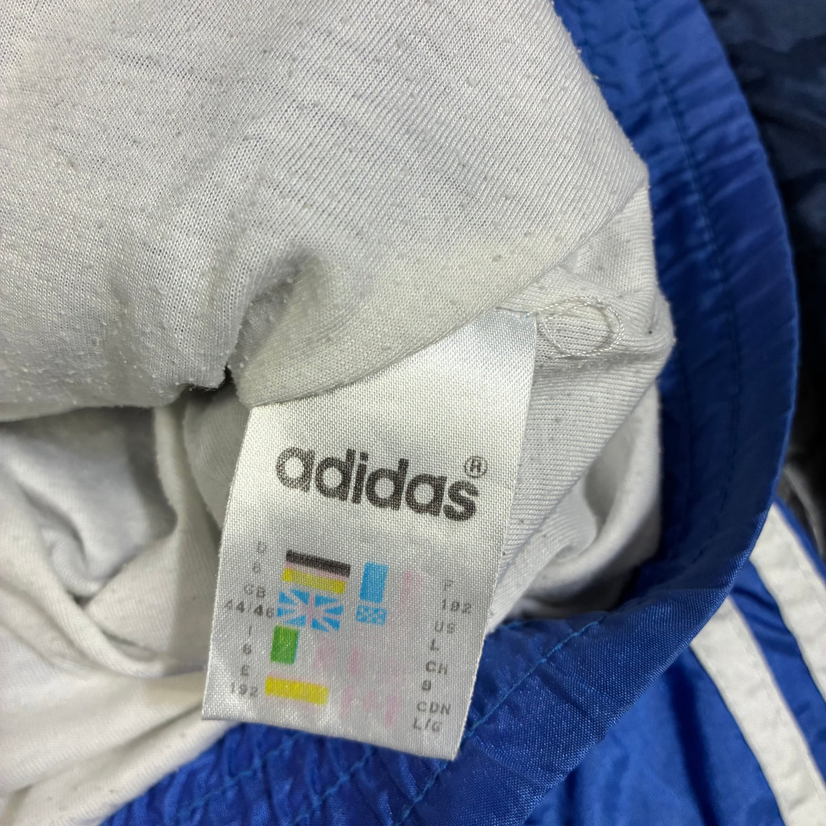 Vintage Adidas nylon tracksuit pants front view