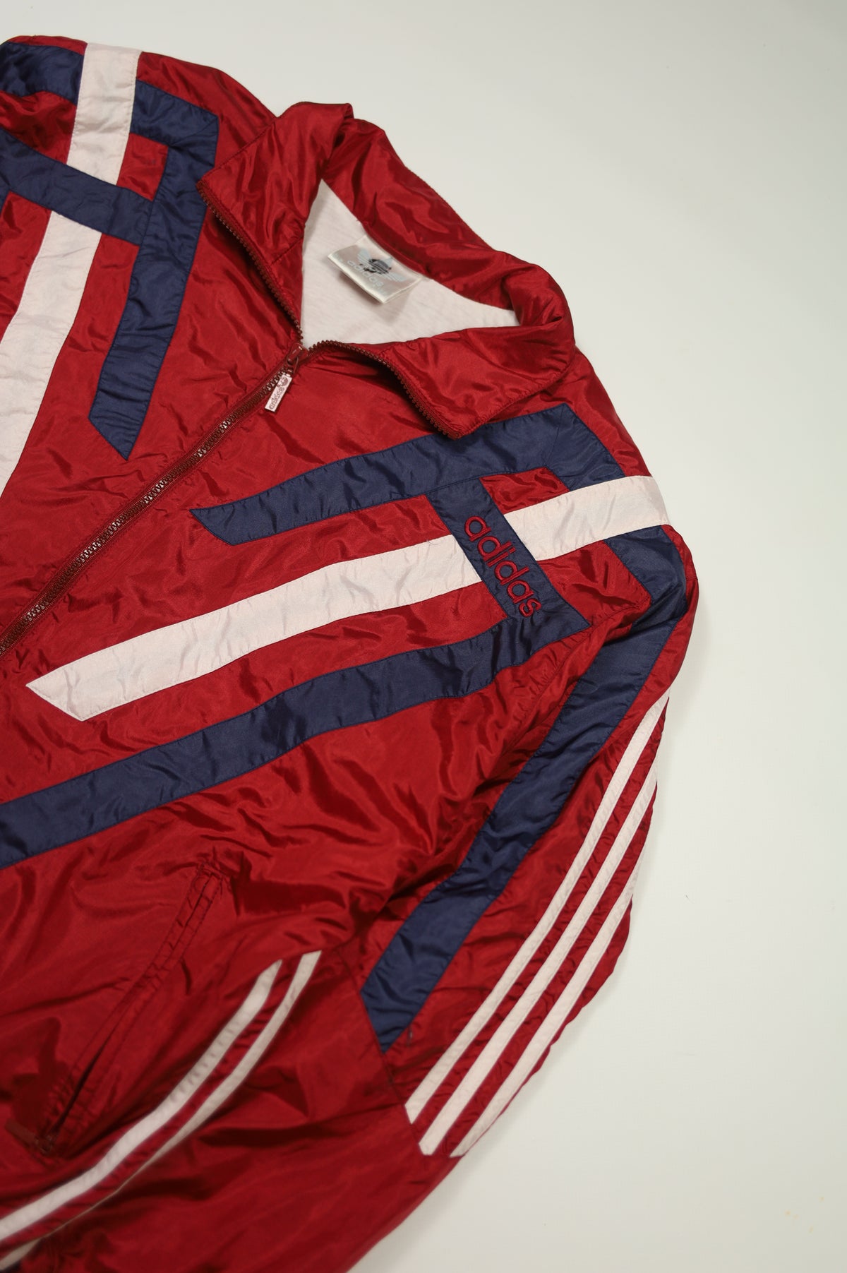 Vintage Adidas red nylon jacket size tag
