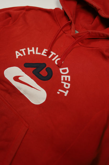 Nike red hoodie size tag close-up