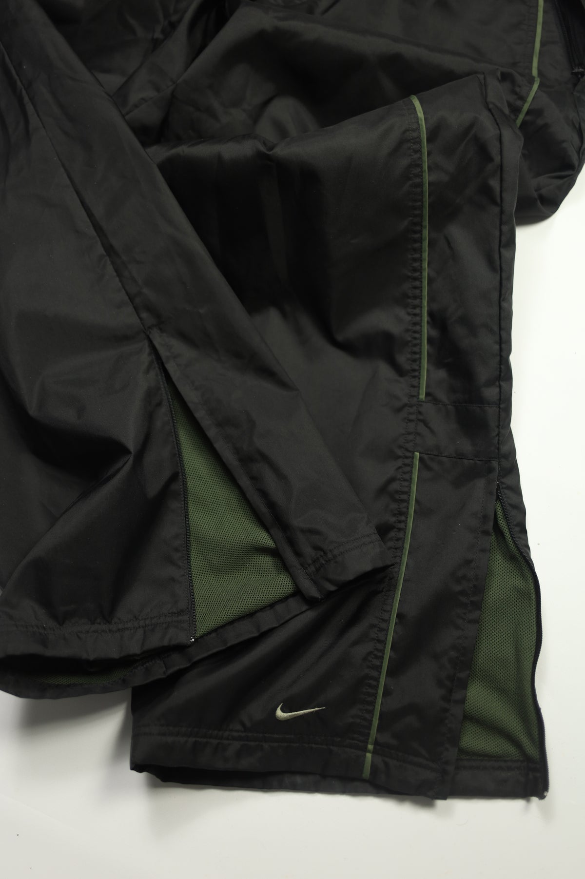Nike black trackpants size tag close-up