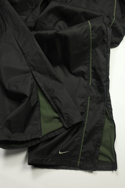 Nike black trackpants size tag close-up