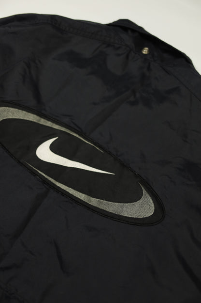Nike big logo jacket size tag close-up