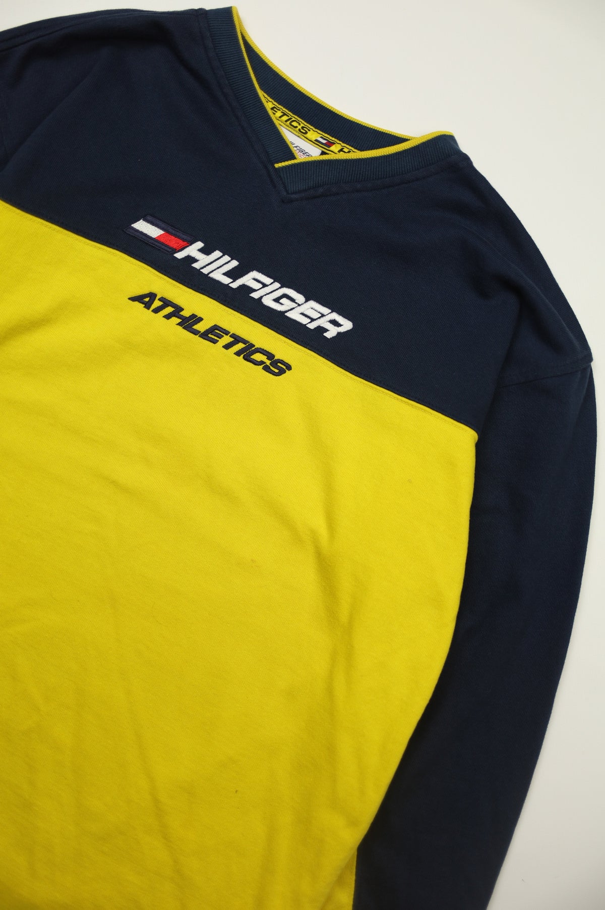 Vintage Tommy Hilfiger flag logo on yellow sweatshirt