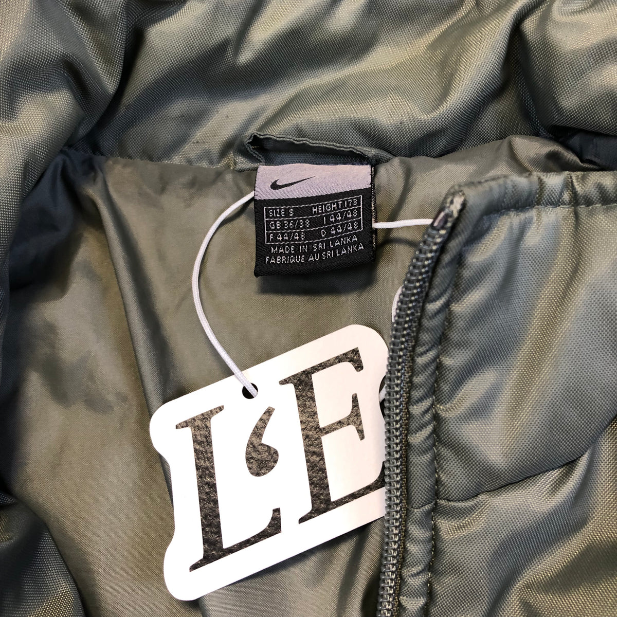 Nike green puffer size tag
