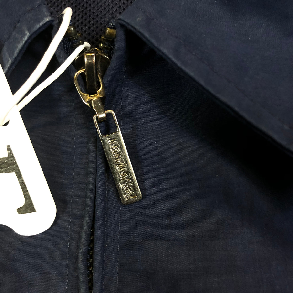 YSL Harrington brand tag