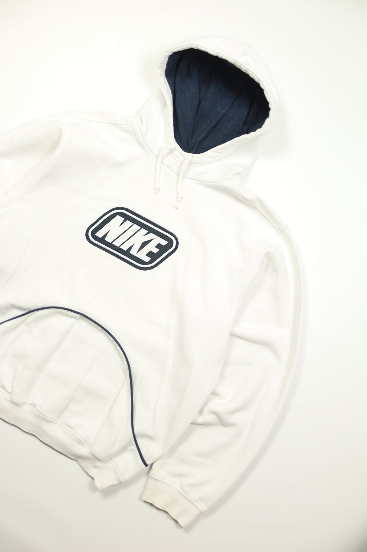 Vintage Nike swoosh detail on white hoodie