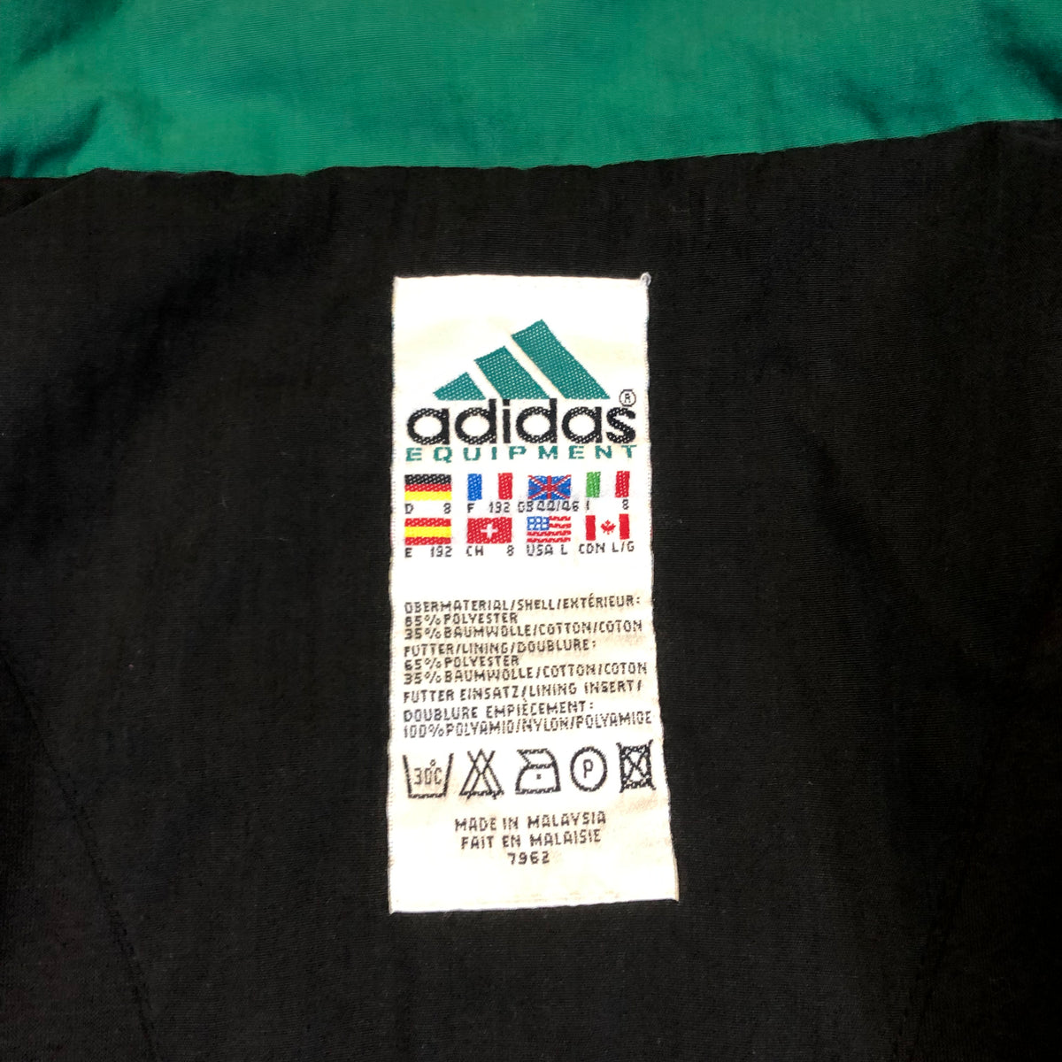 Adidas Equipment padded jacket size tag