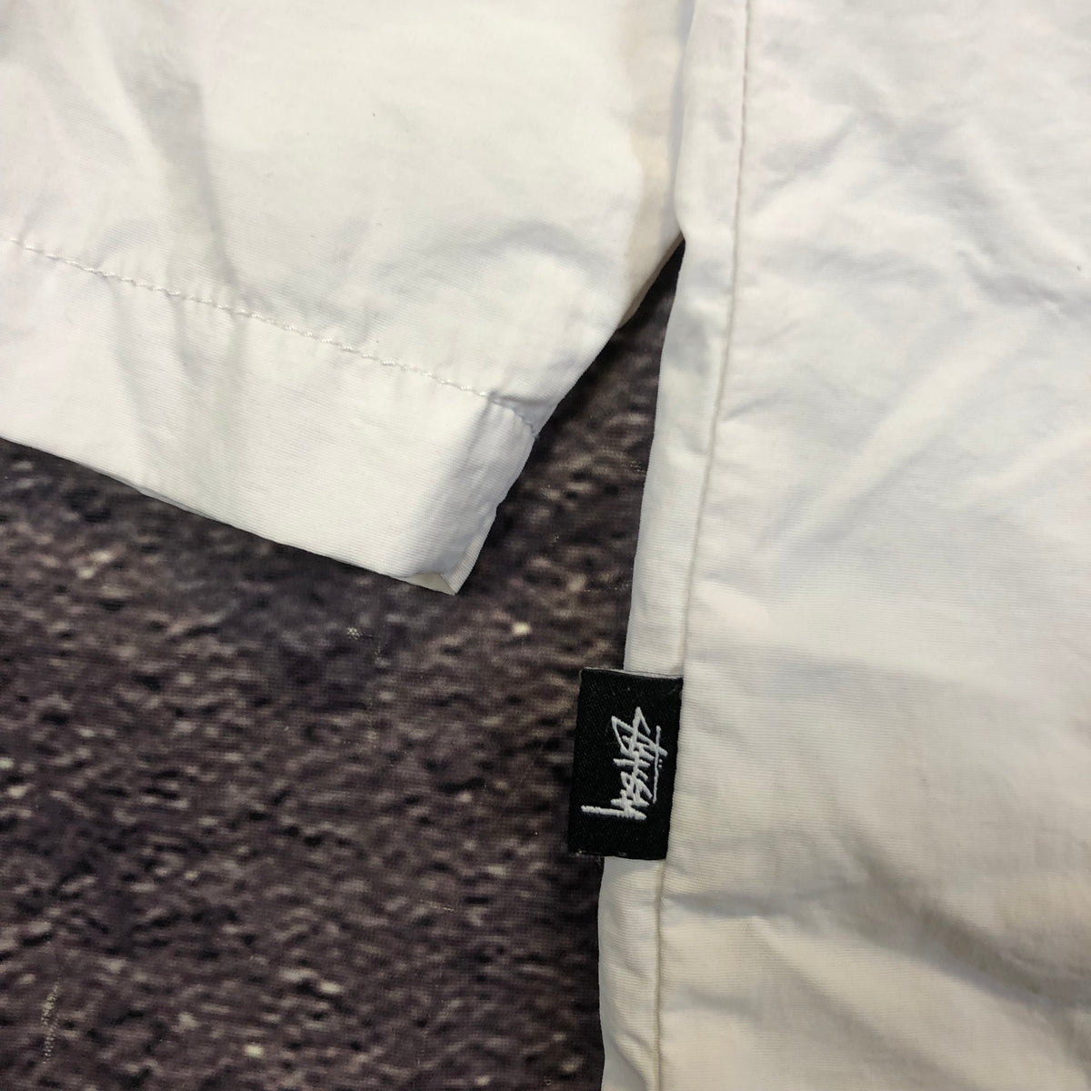 Stussy reflective jacket size tag