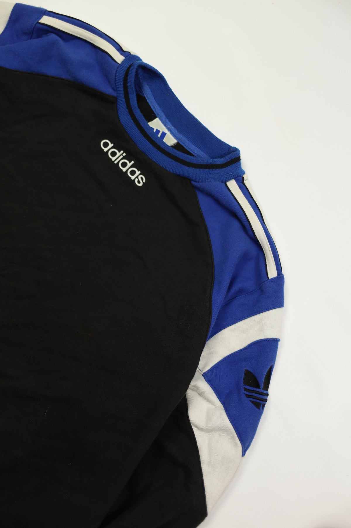 Vintage Adidas trefoil logo on black sweatshirt