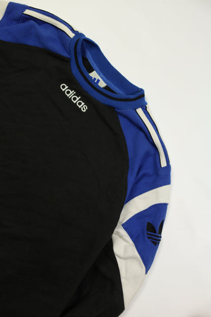 Vintage Adidas trefoil logo on black sweatshirt