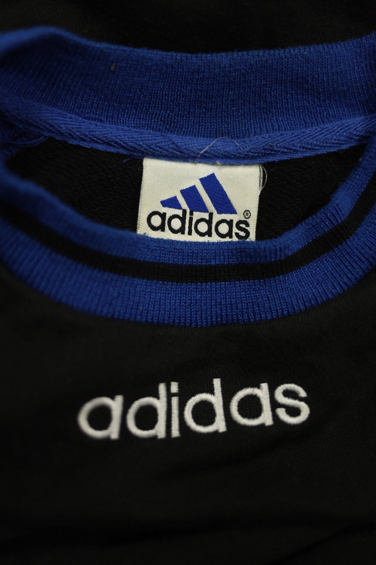 Vintage Adidas black sweatshirt collar close-up