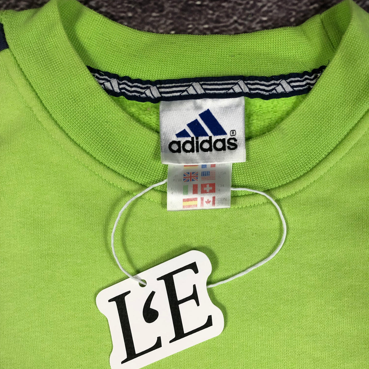 Adidas 1999 green sweatshirt logo detail