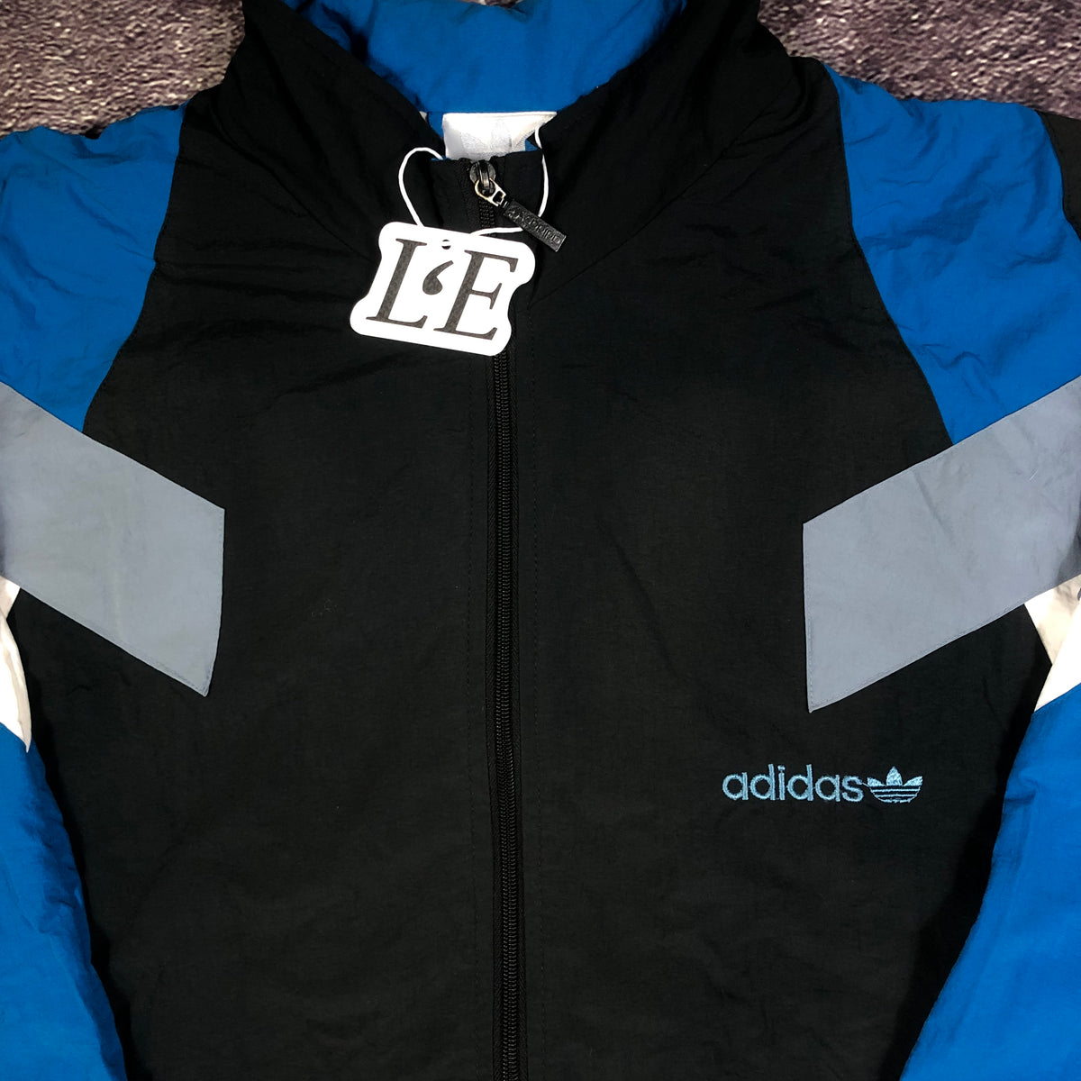Adidas 1999 track jacket logo detail